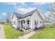 Residential house featuring a decorative porch, tidy landscaping, and sidewalk access at 508 Mount St, Greenfield, IN 46140