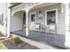 Inviting front porch with seating, plants, and decorative trim on a charming home at 508 Mount St, Greenfield, IN 46140