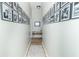 Hallway featuring neutral walls adorned with framed black and white photos and a grey rug at 508 Mount St, Greenfield, IN 46140