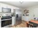 Kitchen showcasing stainless appliances, white cabinets, and an eat-in dining area at 508 Mount St, Greenfield, IN 46140