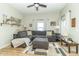 Spacious living room featuring a gray sofa, bright windows, and an inviting atmosphere at 508 Mount St, Greenfield, IN 46140