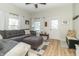 Well-lit living area boasts a comfortable sectional, wood flooring, and stylish accents at 508 Mount St, Greenfield, IN 46140