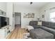 Comfortable living room showcasing a sectional sofa, wood floors, and natural light at 508 Mount St, Greenfield, IN 46140