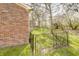 Fenced backyard with green grass and exterior brick, offering a private outdoor space at 5417 Kerns Ln, Indianapolis, IN 46268