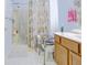 Bright bathroom features a shower, tile floor, and a vanity offering a comfortable and functional space at 5417 Kerns Ln, Indianapolis, IN 46268