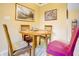 Cozy dining area featuring a round table, comfortable seating, and warm natural lighting at 5417 Kerns Ln, Indianapolis, IN 46268
