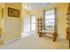 Bright entryway with neutral carpet, a decorative bench, and natural light from a window at 5417 Kerns Ln, Indianapolis, IN 46268