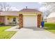 Attached garage with a white door and brick exterior, providing convenient parking at 5417 Kerns Ln, Indianapolis, IN 46268