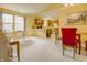 Open-concept living and dining space with a view into the kitchen area, flooded with natural light at 5417 Kerns Ln, Indianapolis, IN 46268
