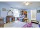 Cozy main bedroom with a sitting area, large window, and walk-in closet, providing comfort and convenience at 5417 Kerns Ln, Indianapolis, IN 46268