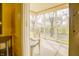 Inviting screened porch with seating overlooking serene backyard and mature trees at 5417 Kerns Ln, Indianapolis, IN 46268