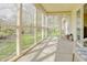 Relaxing screened porch featuring views of green grass and mature trees at 5417 Kerns Ln, Indianapolis, IN 46268