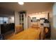 Inviting dining area featuring hardwood floors and a warm, welcoming ambiance at 5707 W Mills Rd, Indianapolis, IN 46221