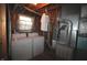 Functional laundry area in the basement features a washer, dryer, and utilities, maximizing space and efficiency at 5707 W Mills Rd, Indianapolis, IN 46221