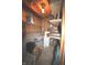 Unfinished basement area offering ample storage space with shelving and exposed ceiling and ductwork at 5707 W Mills Rd, Indianapolis, IN 46221