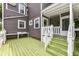 View of the back deck of the house, with view of the house siding, stairs and a sink at 5718 E Pleasant Run Parkway North Dr, Indianapolis, IN 46219