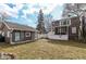 Charming backyard with a cozy cottage-style outbuilding, screened-in porch, and lush garden area with white picket fence at 5718 E Pleasant Run Parkway North Dr, Indianapolis, IN 46219