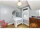 Unique bedroom nook featuring a built-in bed and natural light from large windows at 5718 E Pleasant Run Parkway North Dr, Indianapolis, IN 46219