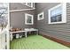 Outdoor potting station on a back patio with a sink and green painted wooden deck at 5718 E Pleasant Run Parkway North Dr, Indianapolis, IN 46219