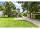 Well-manicured lawn and landscaping complement the charming exterior of this inviting two-story home at 5718 E Pleasant Run Parkway North Dr, Indianapolis, IN 46219