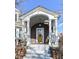 Inviting front porch with detailed trim work and a bright yellow door at 5718 E Pleasant Run Parkway North Dr, Indianapolis, IN 46219