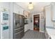 Well-equipped kitchen with stainless steel appliances and a view into the dining room at 5718 E Pleasant Run Parkway North Dr, Indianapolis, IN 46219