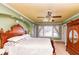 Bright bedroom with hard wood furniture and walk in closet at 5718 E Pleasant Run Parkway North Dr, Indianapolis, IN 46219