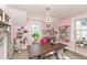 Pink-painted studio with a large table, windows, and decorative lighting fixtures at 5718 E Pleasant Run Parkway North Dr, Indianapolis, IN 46219