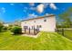 Spacious backyard featuring a wooden deck, lush lawn, and a secure fence, perfect for outdoor enjoyment at 5989 Ashmore Ln, Carmel, IN 46033