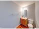 Cozy bathroom featuring a wood vanity, updated fixtures, and fresh paint at 5989 Ashmore Ln, Carmel, IN 46033