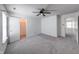 Well-lit bedroom featuring soft gray carpet, a closet and easy access to adjacent rooms at 5989 Ashmore Ln, Carmel, IN 46033