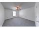 Bedroom featuring soft gray carpet, a ceiling fan, and natural light from the window at 5989 Ashmore Ln, Carmel, IN 46033