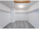 Spacious closet with neutral carpet and shelving, offering ample storage and organization options at 5989 Ashmore Ln, Carmel, IN 46033