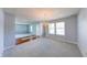 Open dining room with updated lighting and fresh paint leading to the entryway at 5989 Ashmore Ln, Carmel, IN 46033