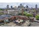 An aerial view shows the building, cityscape and nearby buildings at 624 E Walnut St # 21, Indianapolis, IN 46204