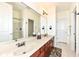 Bathroom features double sinks, granite countertops, large mirrors, and a separate shower at 624 E Walnut St # 21, Indianapolis, IN 46204