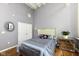 Bedroom with hardwood floors, closet, and nightstand at 624 E Walnut St # 21, Indianapolis, IN 46204