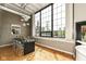 Bright dining room with large windows offers great natural light and hard wood floors at 624 E Walnut St # 21, Indianapolis, IN 46204