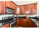 Kitchen features granite countertops, stainless steel appliances, and wooden cabinets at 624 E Walnut St # 21, Indianapolis, IN 46204