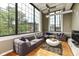 Spacious living room with hardwood floors, large windows and unique ceiling features at 624 E Walnut St # 21, Indianapolis, IN 46204