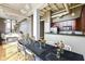 Open concept living area with kitchen, dining area and exposed ceiling and ductwork at 624 E Walnut St # 21, Indianapolis, IN 46204