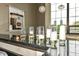 Close up of a bar counter with filled champagne glasses and tall windows at 624 E Walnut St # 21, Indianapolis, IN 46204
