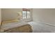 Bright bedroom with a large window and neutral carpet at 6404 Bayside Ct, Indianapolis, IN 46250