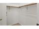 Walk-in closet with wood clothing racks and carpet floors at 6404 Bayside Ct, Indianapolis, IN 46250
