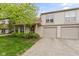 Inviting two-story home features a well-maintained lawn, beautiful greenery, and attached two car garage at 6404 Bayside Ct, Indianapolis, IN 46250