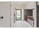 Bright foyer with tiled floors, staircase, coat closet, and a view of the front yard at 6404 Bayside Ct, Indianapolis, IN 46250