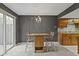 Cozy kitchen space with a small dining table, chairs, and light fixture at 6404 Bayside Ct, Indianapolis, IN 46250
