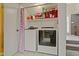 Modern laundry room featuring a washer, dryer, and storage shelves at 6404 Bayside Ct, Indianapolis, IN 46250