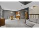 Open concept living room with dining area and kitchen in the background, featuring neutral carpet at 6404 Bayside Ct, Indianapolis, IN 46250