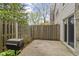 Small outdoor patio with a wooden fence and a grill at 6404 Bayside Ct, Indianapolis, IN 46250